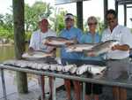 Dinner Table!!! 
The Catch Mike and Chris May (Redfish on ZZZZZZZZZZZZZZ!!!) 
20Redfish (Limited Out!!!) ( 3 of them were Bull Redfish!!!)(Get the Grill Ready!!!) 
The Cajun Thunder Corks were working Over Time, Sometime they didn�t ever hit the water and ZZZZZZZZZZZ!!! Fish On!!! 
Catching on windy Days even with muddy water ZZZZZZZZZZZZZZZZ!!! 
It was a pleasure fishing with Mike and Chris May!!! 
P0108925.JPG