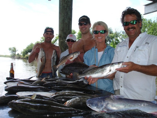 Dinner Table!!!
The Catch: with Cole Ben and Kristie 25 Speckled Trout (3lb to 4lbs class) 10 Redfish (Get the Grill Ready!!!) 2 Southern Flounders 2 Sail Cats Catching with Live Shrimp, Live Croakers, Dead Shrimp, and Lures included in our summer time Special!!! The live croakers are the best bait the Big Girls just can�t resist them!!! This is a late report!!! Busy all the Trips!!! While the Speckled Trout and Galf Top Catfish are right after them!!! What a Feeding Freenzie!!! It was pleasure fishing with Cole Ben and Kristie!!! Don�t Miss Out!!!
P0109979.JPG
